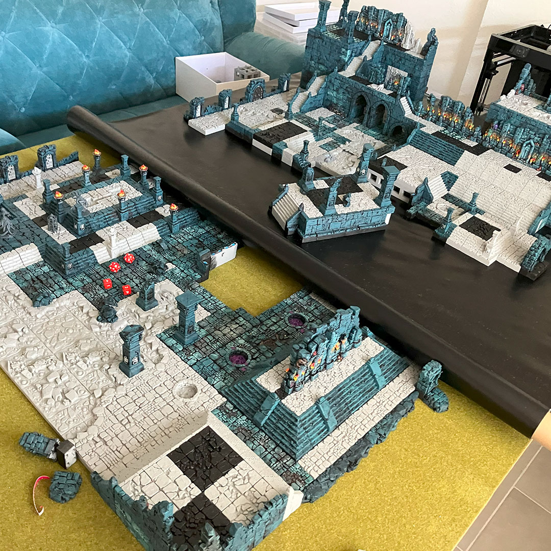 Moving the temple diorama from a grassy game mat to a black vinyl base using magnetized terrain pieces 03