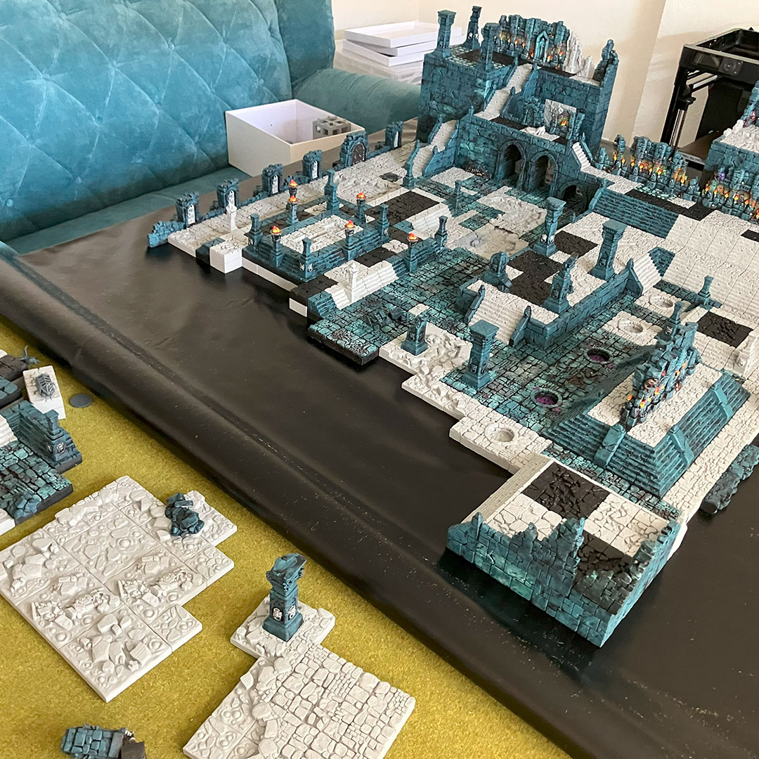 Moving the temple diorama from a grassy game mat to a black vinyl base using magnetized terrain pieces 05