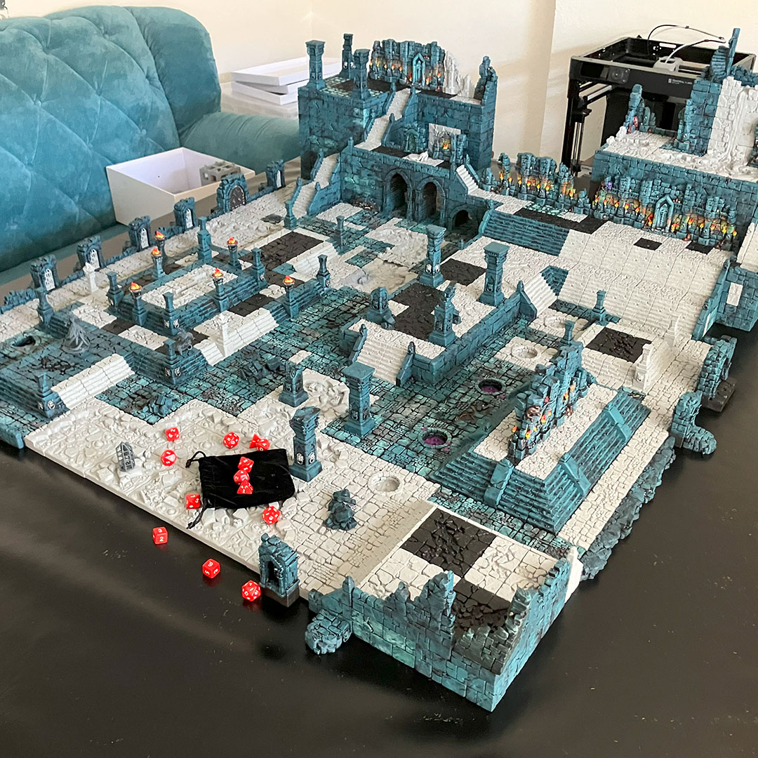 Moving the temple diorama from a grassy game mat to a black vinyl base using magnetized terrain pieces 06